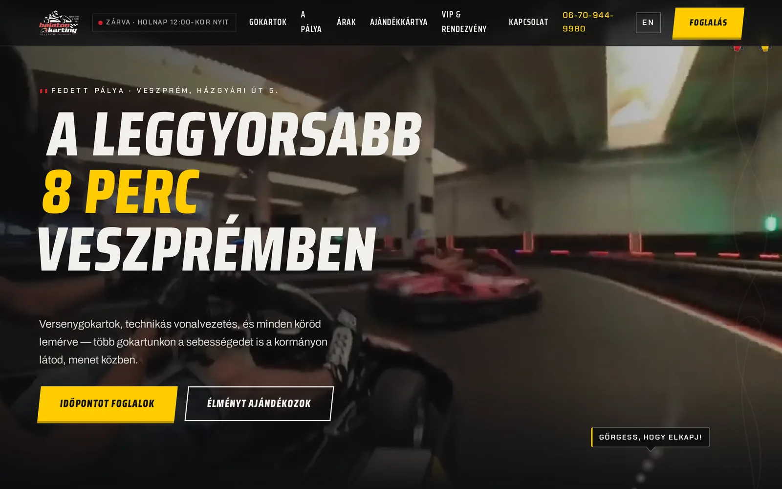 The rebuilt home page on a desktop: the header with the opening status, the headline over the track's video, the two karts in the right margin